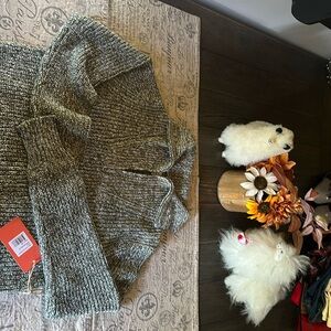 Very nice and warm stylish sweater. This sweater is new with tags